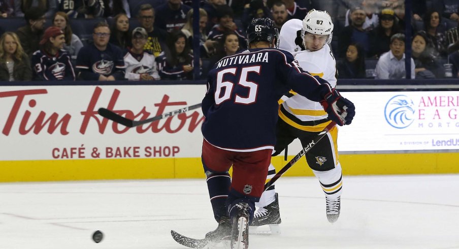 Sidney Crosby shoots the puck against the Columbus Blue Jackets