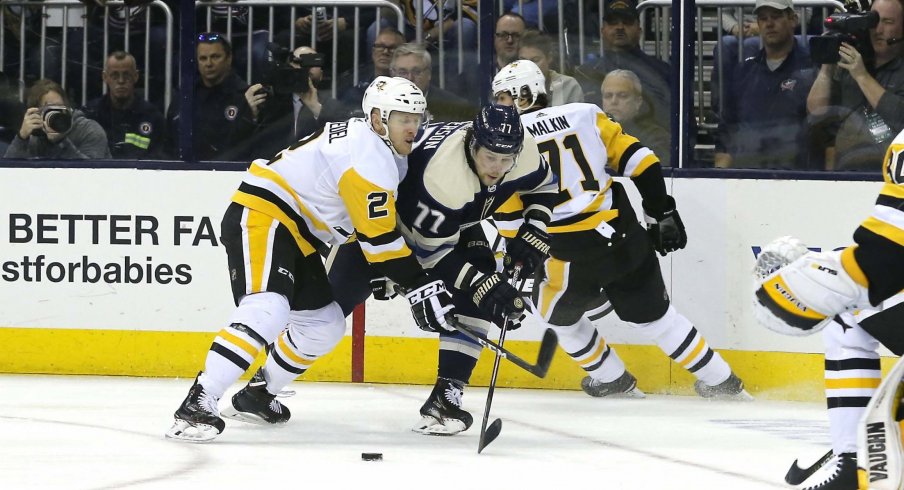 Pittsburgh Penguins defenseman Chad Ruhwedel (2) checks Columbus Blue Jackets right wing Josh Anderson (77) during the second period at Nationwide Arena.