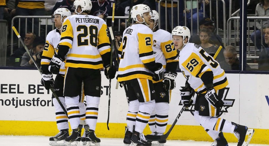 Jake Guentzel and the Penguins celebrate a goal against the Columbus Blue Jackets at Nationwide Arena