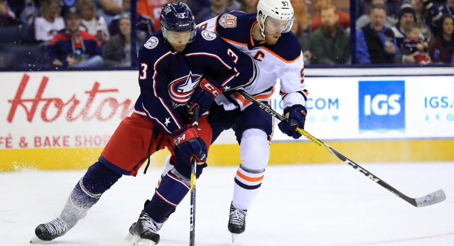 Columbus Blue Jackets defenseman Seth Jones defends against Edmonton Oilers captain Connor McDavid during a game at Nationwide Arena.