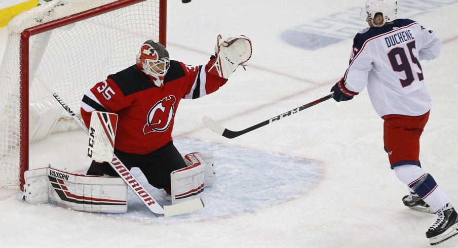 Cory Schneider keeps the puck out of the net against Matt Duchene during the first period at Prudential Center.