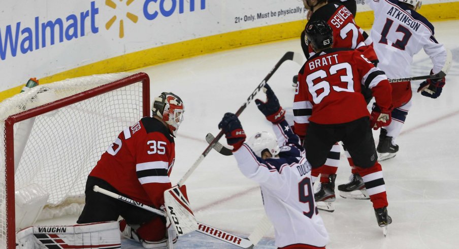 Columbus Blue Jackets right wing Cam Atkinson (13) celebrates after scoring a goal against New Jersey Devils goaltender Cory Schneider (35) during the first period at Prudential Center.