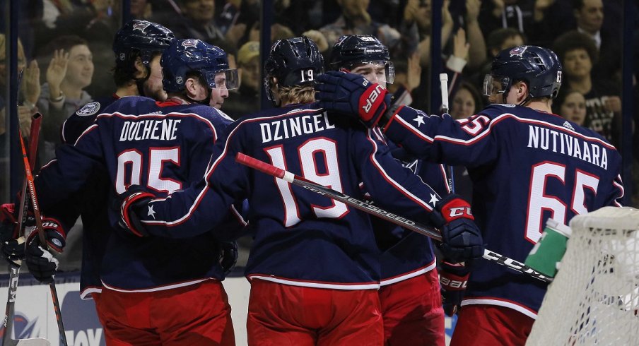 Matt Duchene, Ryan Dzingel, and Josh Anderson celebrate a goal against the Blue Jackets against the Boston Bruins