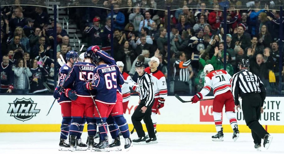 The Columbus Blue Jackets celebrate a first period goal from defenseman David Savard against the Carolina Hurricanes at Nationwide Arena.