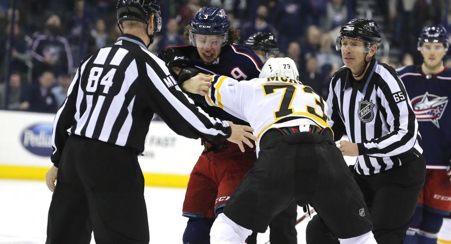 Artemi Panarin drops the mitts with Charlie McAvoy