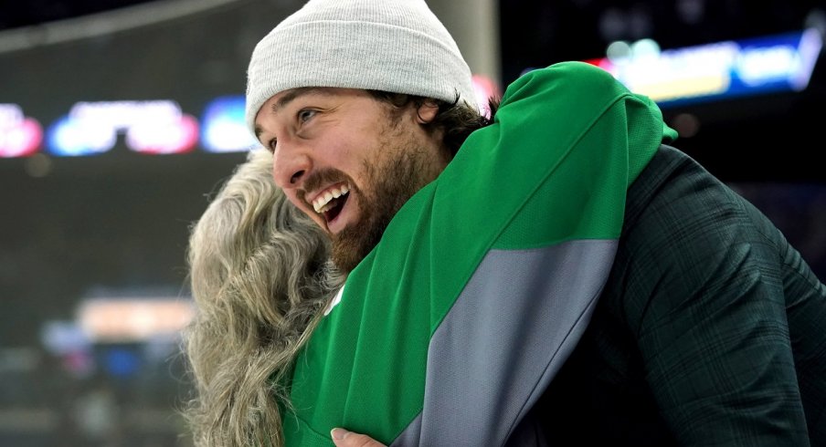 Keith Kinkaid hugs a fan post-game after the Columbus Blue Jackets St. Patrick's Day game