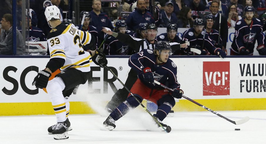 Apr 2, 2019; Columbus, OH, USA; Columbus Blue Jackets left wing Ryan Dzingel (19) skates away from Boston Bruins defenseman Zdeno Chara (33) during the second period at Nationwide Arena.