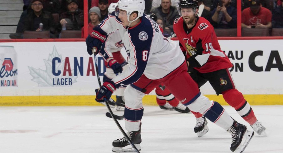 Feb 22, 2019; Ottawa, Ontario, CAN; Columbus Blue Jackets defenseman Zach Werenski (8) shoots the puck in the first period against the Ottawa Senators at the Canadian Tire Centre.