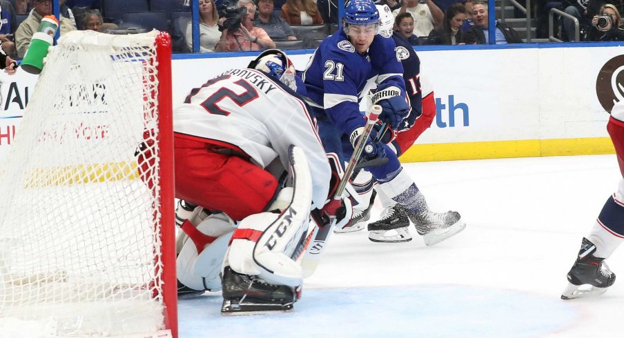 Columbus Blue Jackets goaltender Sergei Bobrovsky watches as Tampa Bay Lightning forward Brayden Point controls the puck at Amalie Arena.