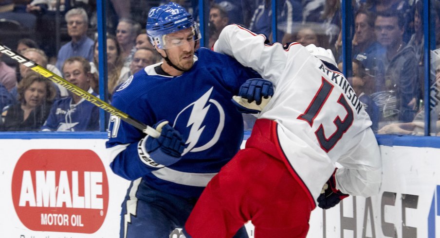 Columbus Blue Jackets forward Cam Atkinson collides with Tampa Bay Lightning defenseman Ryan McDonagh during a game at Amalie Arena in Tampa, Florida.