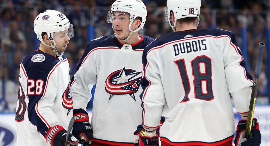 Columbus Blue Jackets center Pierre-Luc Dubois celebrates a goal with Oliver Bjorkstrand and Zach Werenski.