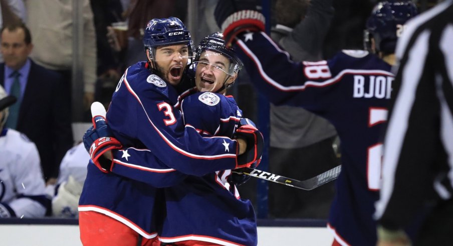 Columbus Blue Jackets defenseman Seth Jones (3) celebrates the goal scored by center Alexandre Texier (right) against the Tampa Bay Lightning in the first period during game four of the first round of the 2019 Stanley Cup Playoffs at Nationwide Arena.