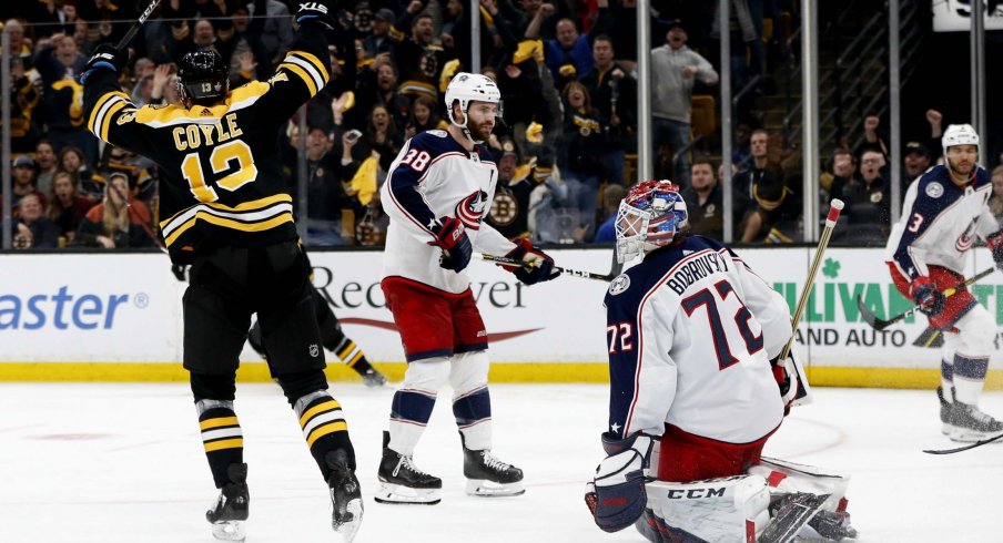 Apr 25, 2019; Boston, MA, USA; Boston Bruins center Charlie Coyle (13) celebrates after scoring the game winning against Columbus Blue Jackets goaltender Sergei Bobrovsky (72) during the overtime period in game one of the second round of the 2019 Stanley Cup Playoffs at TD Garden.