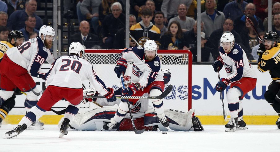 Apr 25, 2019; Boston, MA, USA; Columbus Blue Jackets center Brandon Dubinsky (17) clears the puck away from goaltender Sergei Bobrovsky (72) against the Boston Bruins during the first period in game one of the second round of the 2019 Stanley Cup Playoffs at TD Garden.