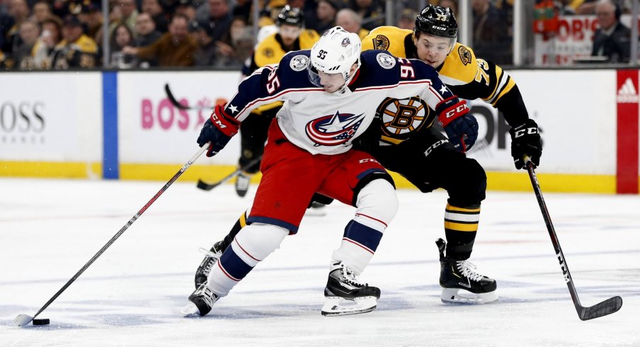 Apr 25, 2019; Boston, MA, USA; Columbus Blue Jackets center Matt Duchene (95) controls the puck against Boston Bruins defenseman Charlie McAvoy (73) during the third period in game one of the second round of the 2019 Stanley Cup Playoffs at TD Garden.