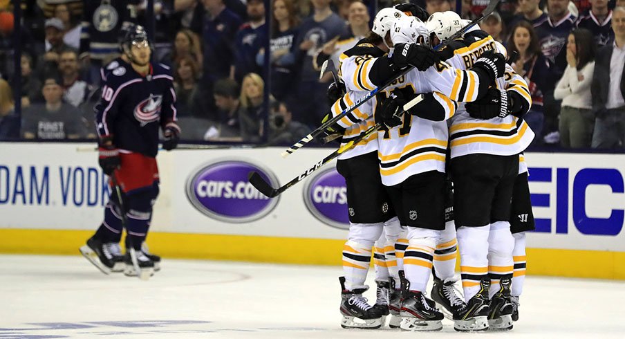 Patrice Bergeron celebrates with his Bruins teammates after scoring to put Boston up 2-0 on Columbus in Game 4.