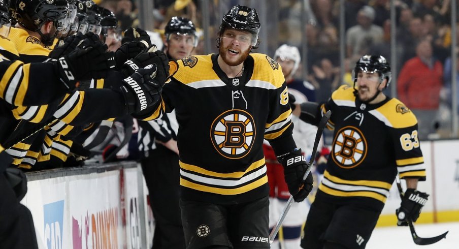David Pastrnak celebrates a goal with his Boston Bruins teammates