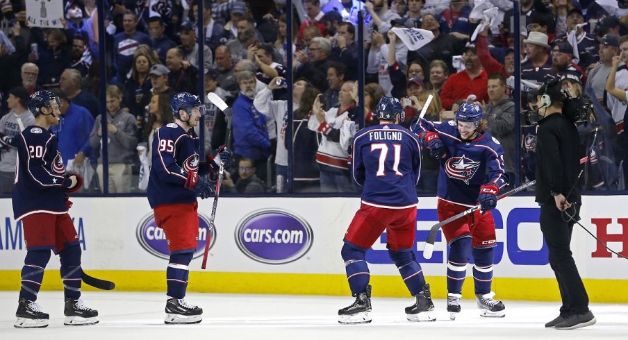 Matt Duchene, Nick Foligno and Artemi Panarin celebrate after defeating the Boston Bruins in game three of the second round of the 2019 Stanley Cup Playoffs