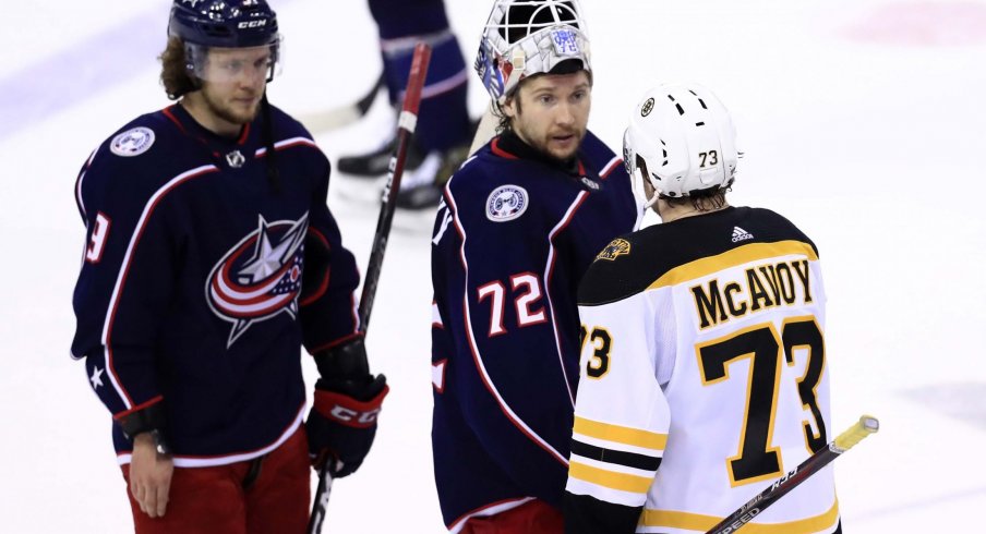 Columbus Blue Jackets goaltender Sergei Bobrovsky (72) shakes hands with Boston Bruins defenseman Charlie McAvoy (73) after game six of the second round of the 2019 Stanley Cup Playoffs at Nationwide Arena.