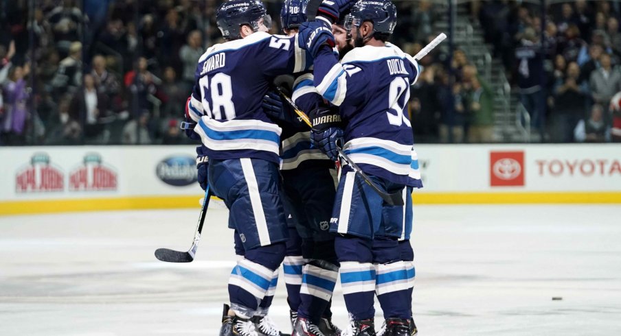 Oct 18, 2018; Columbus, OH, USA; Columbus Blue Jackets left wing Nick Foligno (back right) celebrates with teammates defenseman David Savard (58) and left wing Anthony Duclair (91) after scoring a goal against the Philadelphia Flyers in the second period at Nationwide Arena.