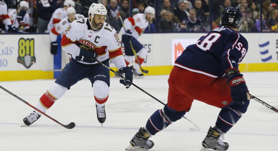 Florida Panthers captain Derek MacKenzie (17) skates with the puck against his former team, the Columbus Blue Jackets, during a game at Nationwide Arena.