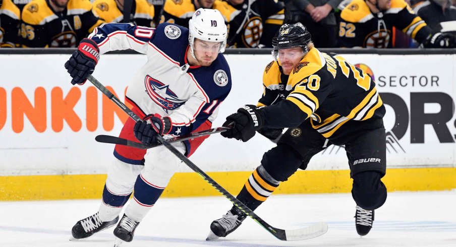Mar 16, 2019; Boston, MA, USA; Columbus Blue Jackets center Alexander Wennberg (10) and Boston Bruins center Joakim Nordstrom (20) battle for control of the puck during the first period of a game at the TD Garden.