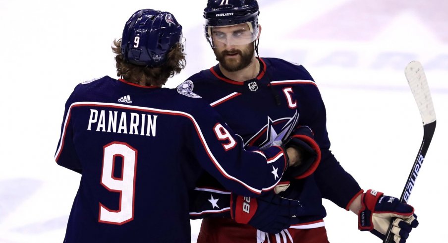 Columbus Blue Jackets left wing Artemi Panarin (9) hugs left wing Nick Foligno (71) after being defeated by the Boston Bruins in game six of the second round of the 2019 Stanley Cup Playoffs at Nationwide Arena. 