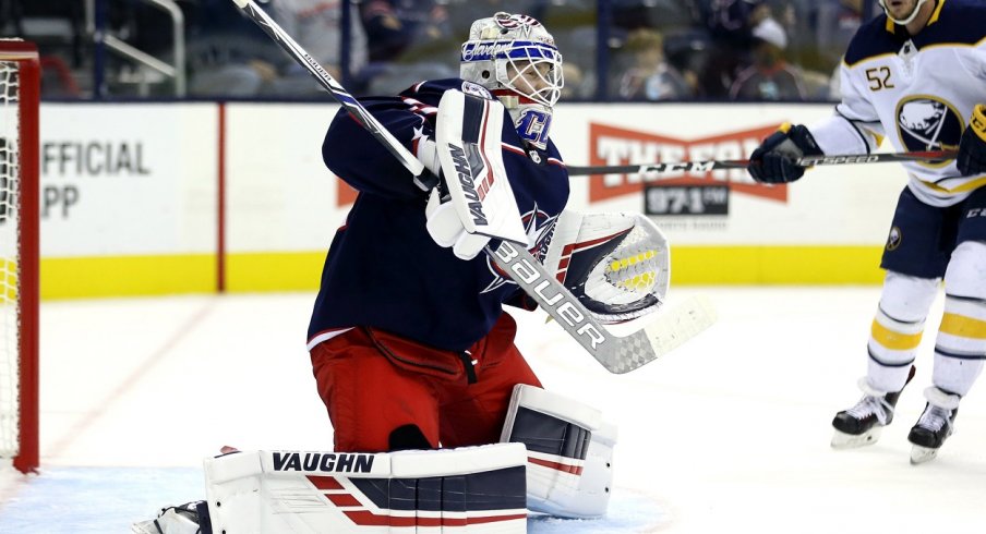 Columbus Blue Jackets goaltender Matiss Kivlenieks (80) makes a save in net against the Buffalo Sabres in the first period at Nationwide Arena