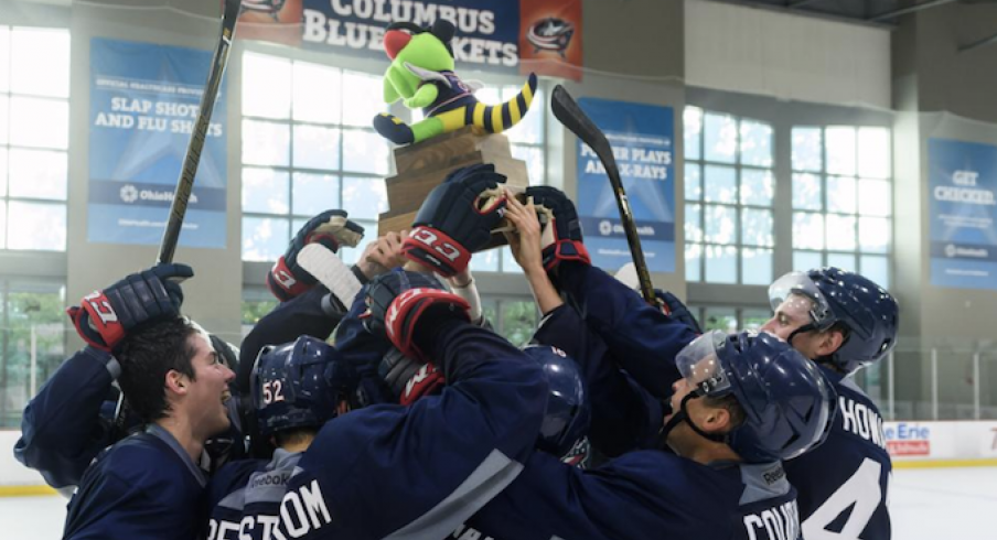 Columbus Blue Jackets prospects celebrate a tournament title at the OhioHealth Ice Haus in Columbus.