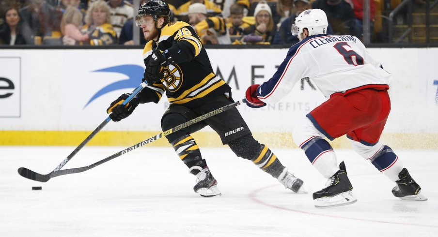 Columbus Blue Jackets defenseman Adam Clendening defends against Boston Bruins forward David Pastrnak during the Stanley Cup Playoffs.