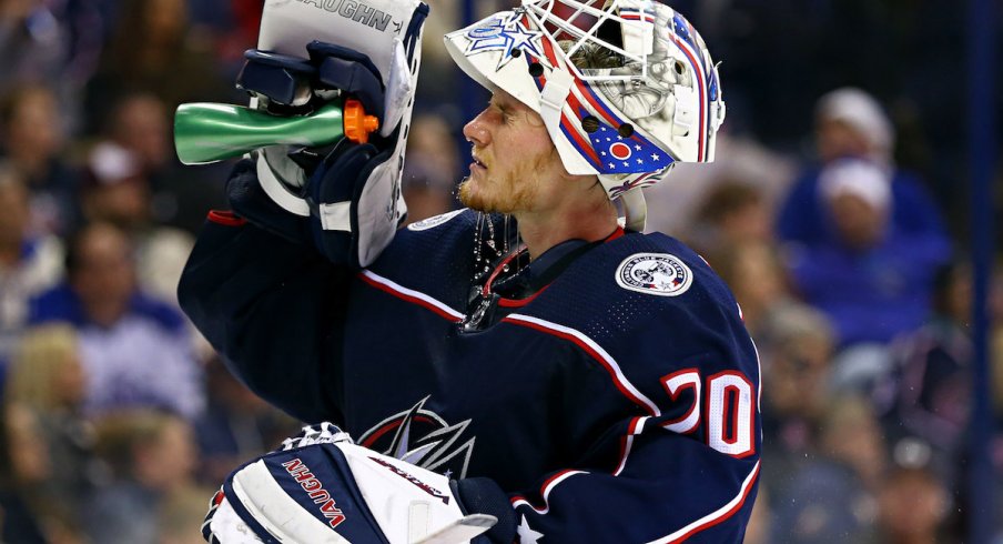 Columbus Blue Jackets goaltender Joonas Korpisalo hydrates during a stoppage in play at Nationwide Arena.