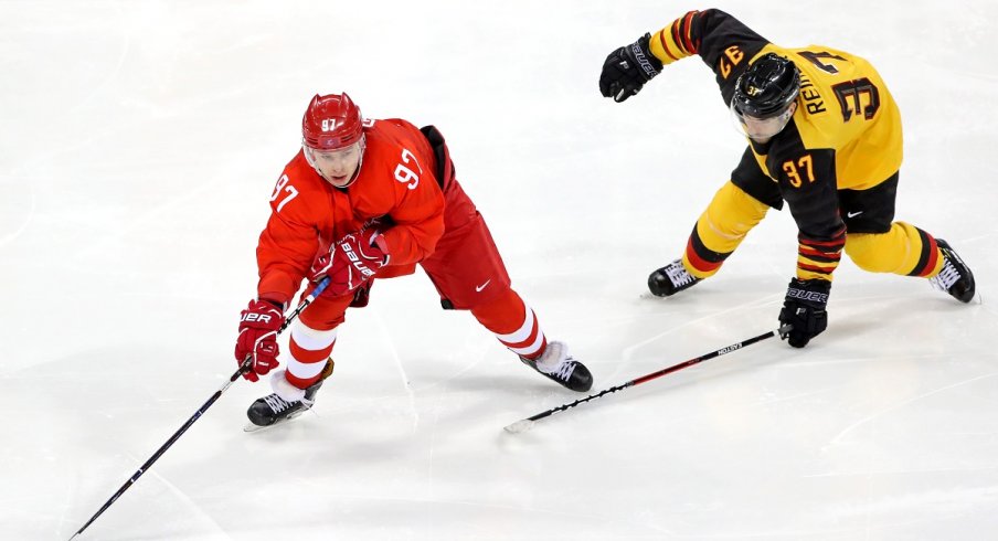 Nikita Gusev stickhandles for OAR in the Gold Medal hockey game against Germany