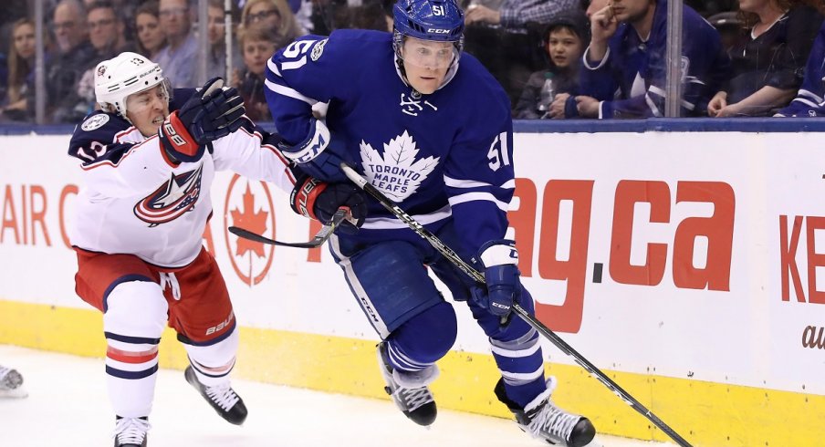 Cam Atkinson tries to chase down Jake Gardiner