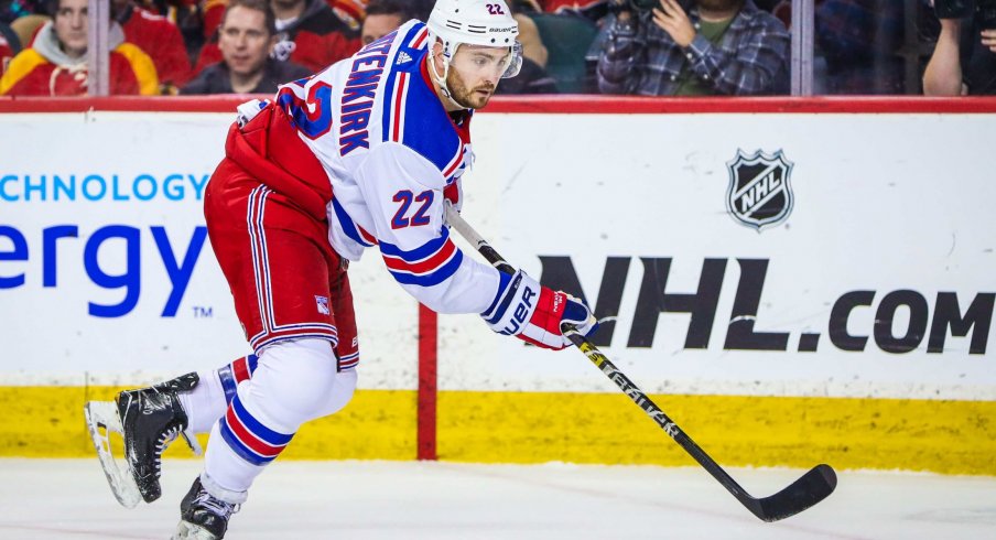 Mar 15, 2019; Calgary, Alberta, CAN; New York Rangers defenseman Kevin Shattenkirk (22) controls the puck against the Calgary Flames during the third period at Scotiabank Saddledome. Calgary Flames won 5-1.