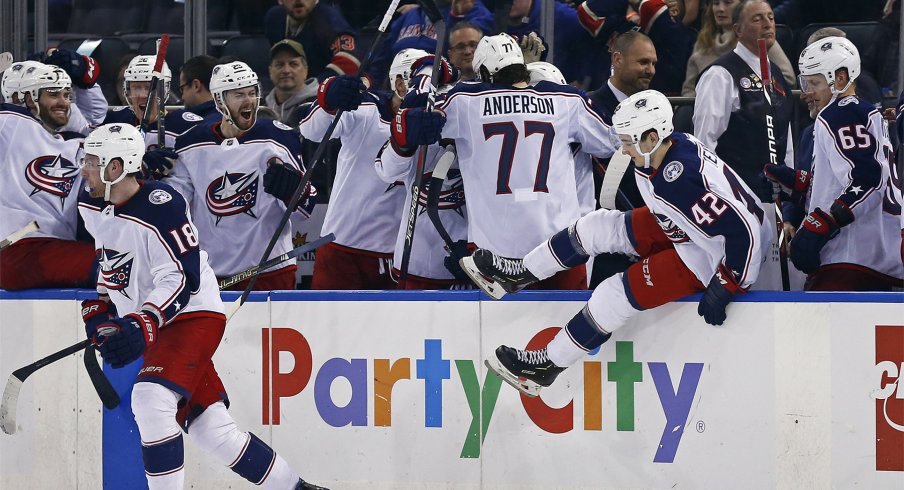 The Columbus Blue Jackets bench celebrates after defeating the New York Rangers in a shoot out at Madison Square Garden.