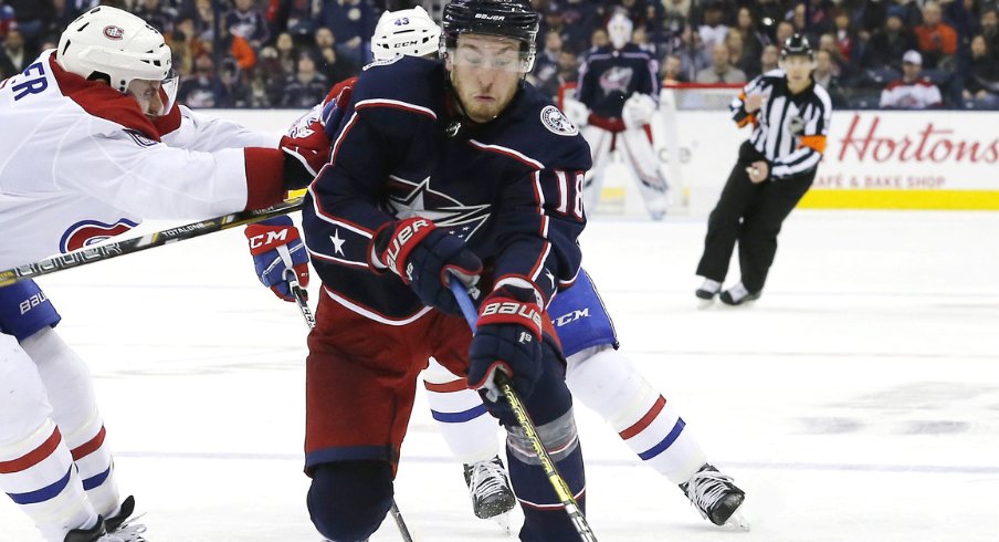 Columbus Blue Jackets center Pierre-Luc Dubois attempts to fend off Shea Weber, defenseman for the Montreal Canadiens during a regular-season matchup at Nationwide Arena during January of 2019.