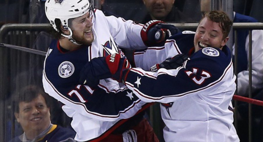 Columbus Blue Jacket forwards Cam Atkinson and Josh Anderson celebrate after defeating the New York Rangers in April of 2019 at Madison Square Garden to clinch a playoff berth. 
