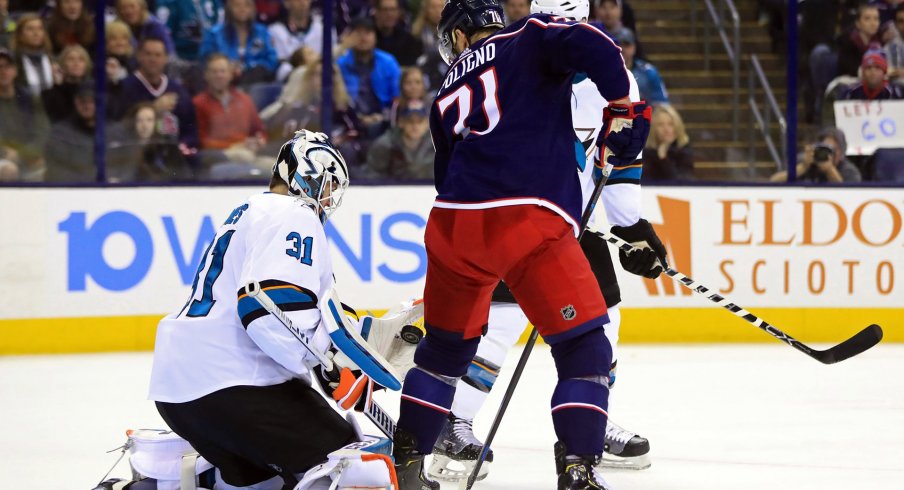 San Jose Sharks goaltender Martin Jones (31) makes a save in his glove as Columbus Blue Jackets left wing Nick Foligno (71) screens in the second period at Nationwide Arena.