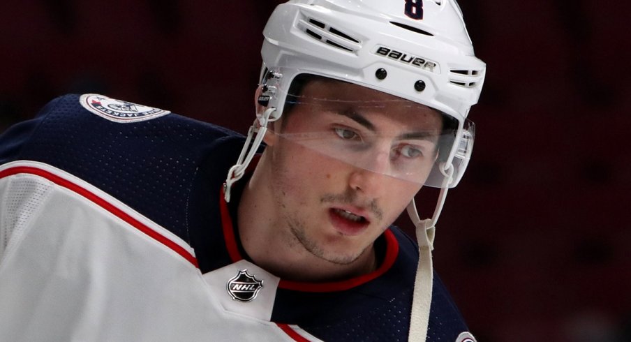 Werenski looks on in warm-ups against the Montreal Canadiens