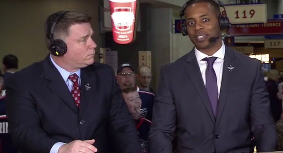 Jean-Luc Grand-Pierre speaks with Bob McElligott before Game 4 of the Stanley Cup Playoffs at Nationwide Arena.