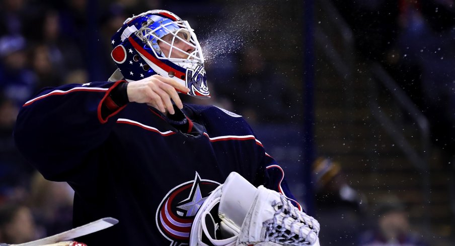 Columbus Blue Jackets goaltender Joonas Korpisalo (70) spits water from his Gatorade bottle during a stop in play against the Tampa Bay Lightning at Nationwide Arena.