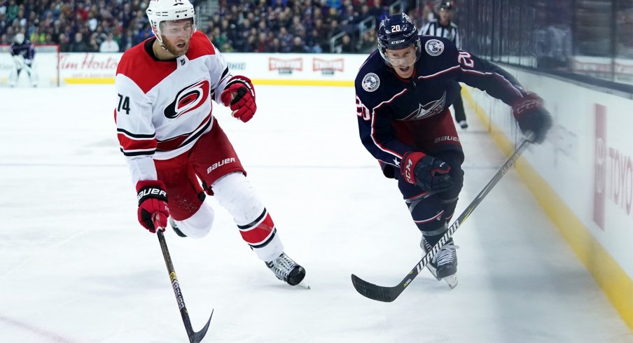 Mar 15, 2019; Columbus, OH, USA; Carolina Hurricanes defenseman Jaccob Slavin (74) skates against Columbus Blue Jackets center Riley Nash (20) in the second period at Nationwide Arena.