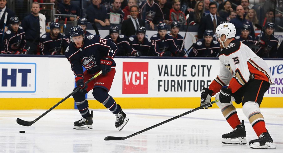 Columbus Blue Jackets center Riley Nash (20) carries the puck as Anaheim Ducks defenseman Korbinian Holzer (5) defends during the second period at Nationwide Arena. 