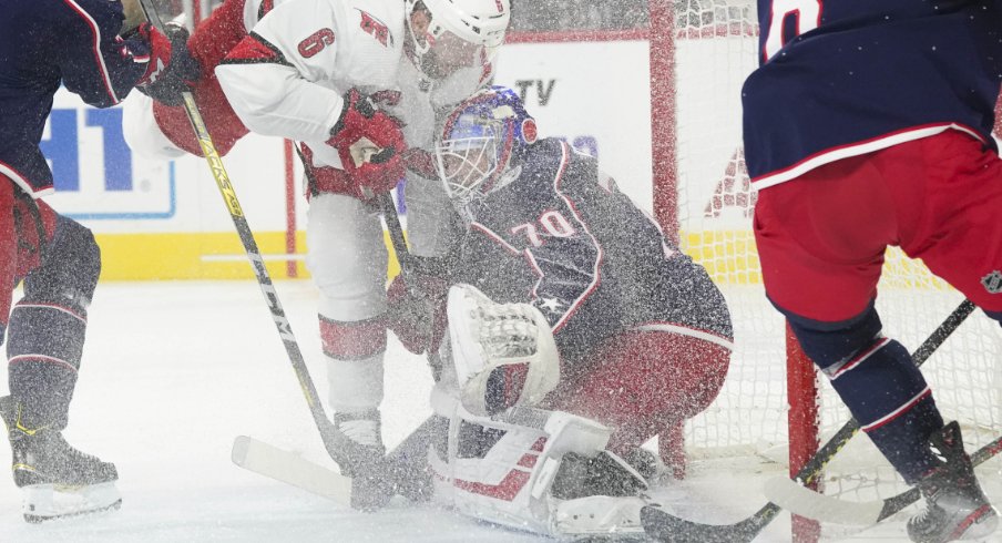 Columbus Blue Jackets goaltender Joonas Korpisalo is pictured attempting to make a save during a regular-season matchup against the Carolina Hurricanes at PNC Arena during October of 2019.