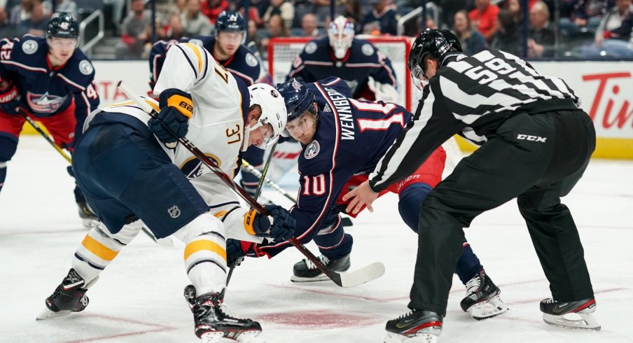 Oct 7, 2019; Columbus, OH, USA; Buffalo Sabres center Casey Mittelstadt (37) battles against Columbus Blue Jackets center Alexander Wennberg (10) for the face-off in the second period at Nationwide Arena.