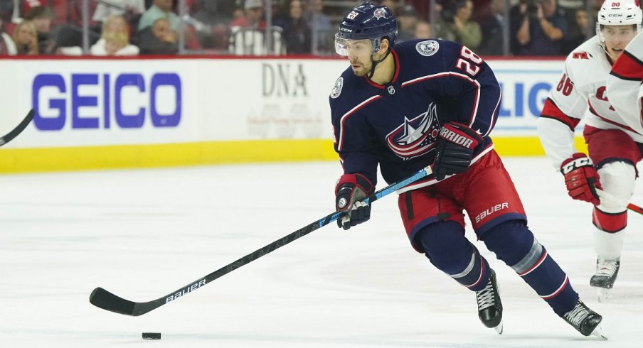 Oliver Bjorkstrand skates with the puck against the Carolina Hurricanes