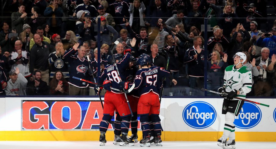 Oct 16, 2019; Columbus, OH, USA; Columbus Blue Jackets center Alexander Wennberg (10) celebrates with teammates after scoring a goal against the Dallas Stars in the first period at Nationwide Arena.