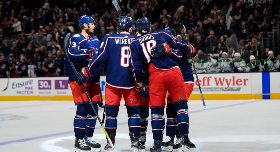 Columbus Blue Jackets defenseman Zach Werenski (8) celebrates with teammates after scoring a goal against the Dallas Stars in the first period at Nationwide Arena. Mandatory Credit: Aaron Doster-USA TODAY Sports