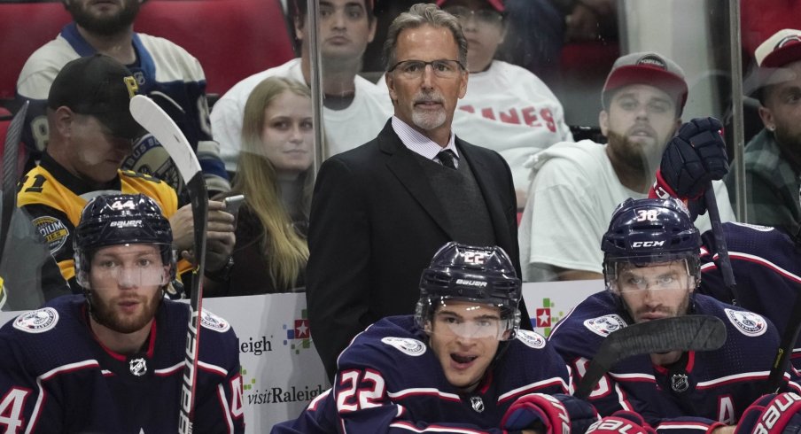 Oct 12, 2019; Raleigh, NC, USA; Carolina Hurricanes head coach John Tortorella looks on from behind the p[layers bench against the Carolina Hurricanes at PNC Arena. The Columbus Blue Jackets defeated the Carolina Hurricanes 3-2.