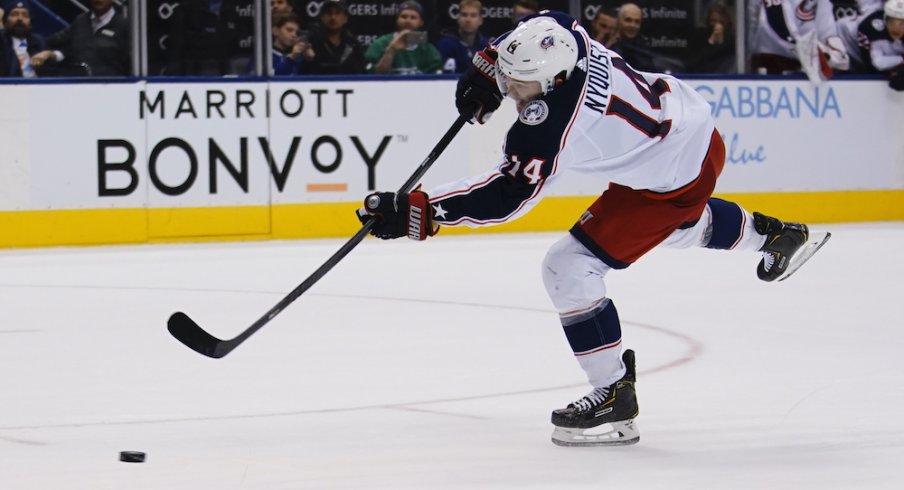 Columbus Blue Jackets forward Gustav Nyquist (14) scores the game winning goal against the Toronto Maple Leafs on a penalty shot at Scotiabank Arena. Columbus defeated Toronto in overtime. 